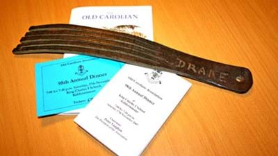 Here's a more detailed picture of this notorious instrument of torture, shown with 'The Old Carolian' Magazine and 98th Annual Dinner ticket and menu, to give an idea of scale. Note the name 'Drake' scratched into the cosh; this was presumably to ensure that it didn't get mistaken for anybody else's cosh in the School!