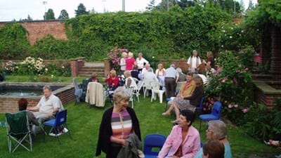 The guests continue their socialising.