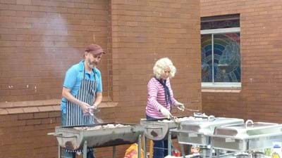 Half of the cooking team are too busy to notice a roaming photographer.