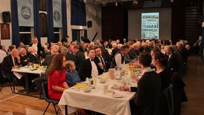 All seated, enjoying the meal and good company.
