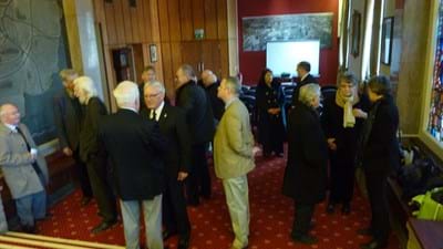 Attendees gathering in the King Charles I Room before the service began.