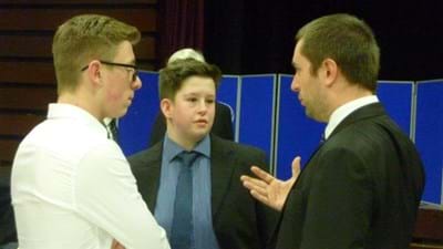 Joel Douglas talking to students Ben Onslow and Joe Caldwell.