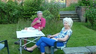 Roger and Penny propose a toast to the evening's success.