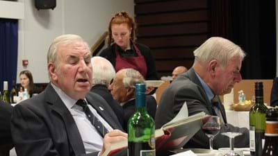 Anthony Bunn, next to his twin brother, Keith, records his attendance for posterity in the official book.