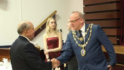 The mayor not weighed down by the heavy burden of his office; the ceremonial chain, on the other hand...
